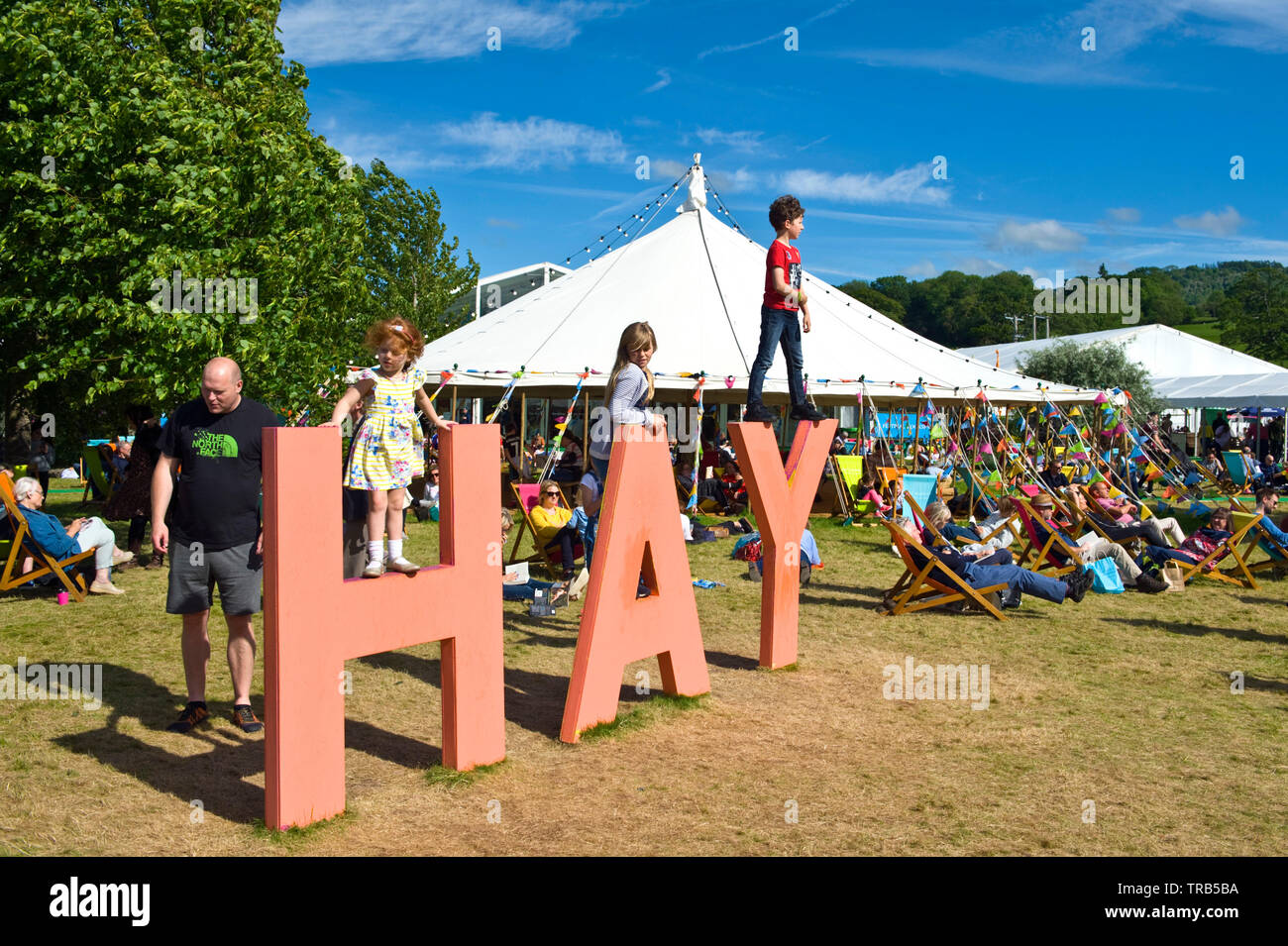 Visitors relaxing at Hay Festival Hay on Wye Powys Wales UK Stock Photo