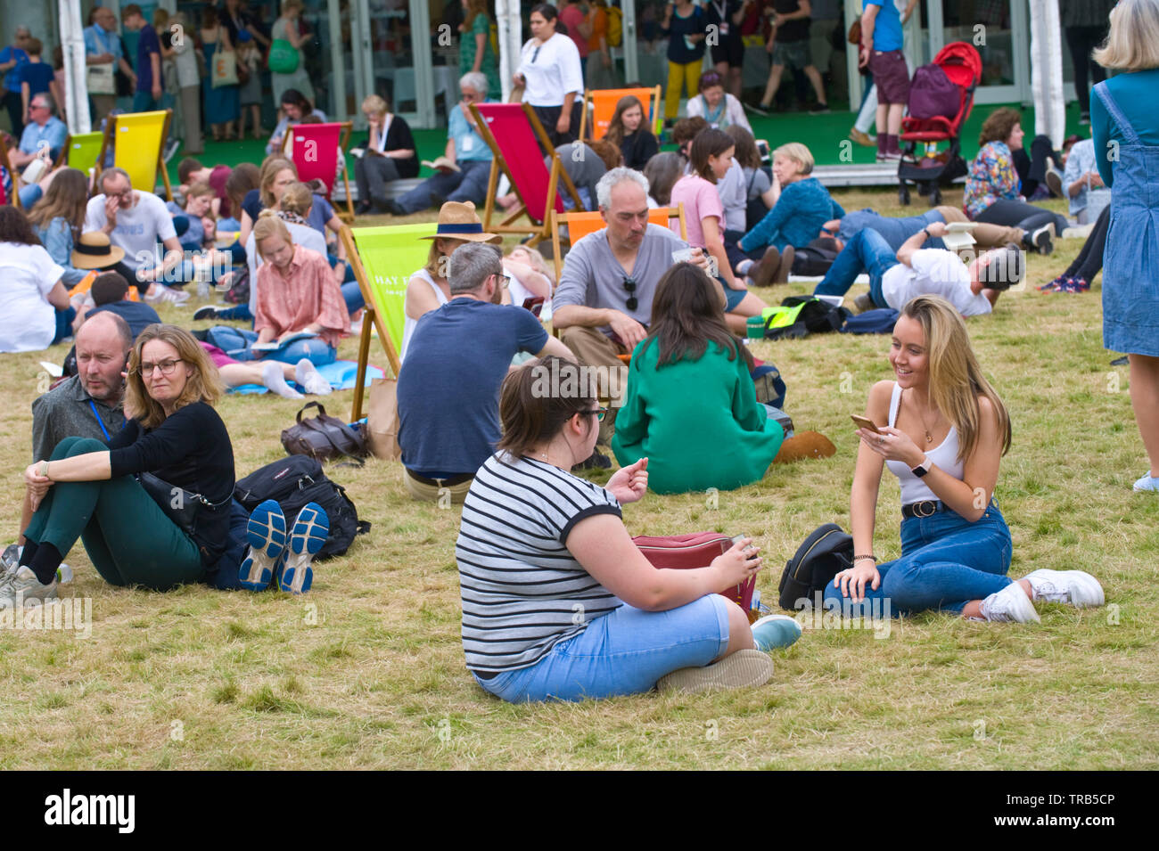 Visitors relaxing at Hay Festival Hay on Wye Powys Wales UK Stock Photo