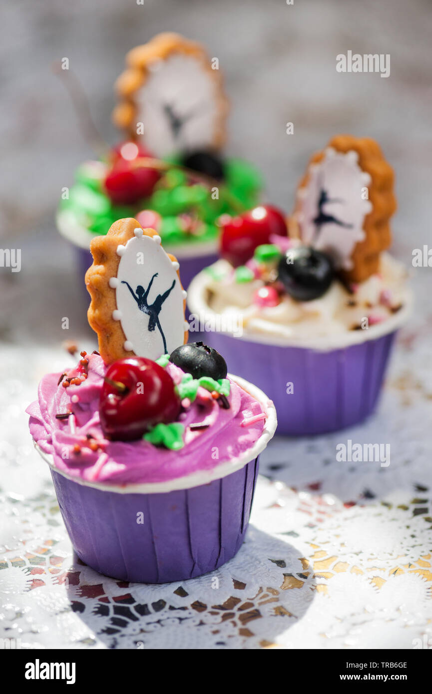 cupcakes with berries and decorative gingerbread Stock Photo