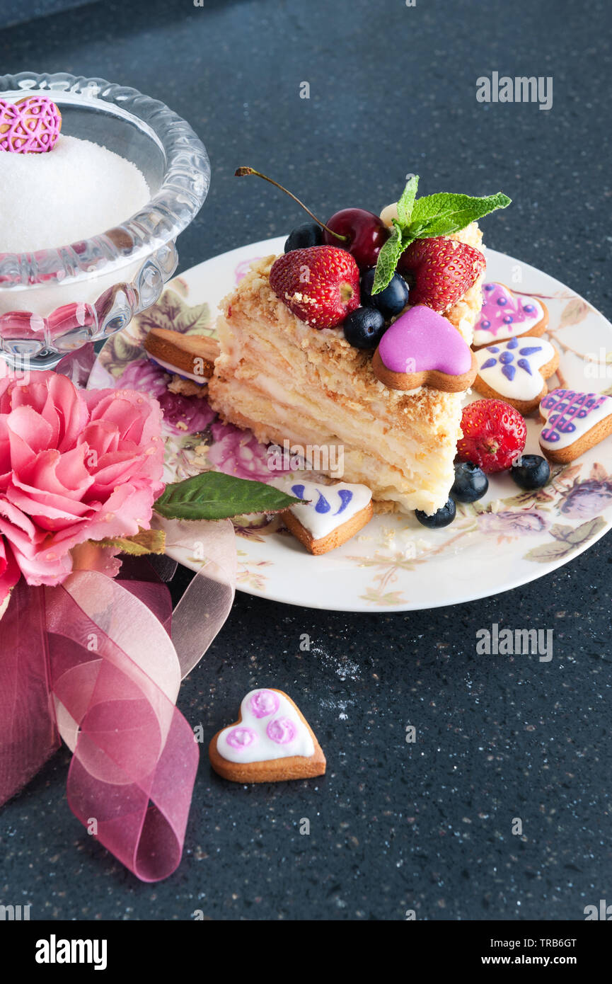 a piece of cake napoleon on plate with berries Stock Photo