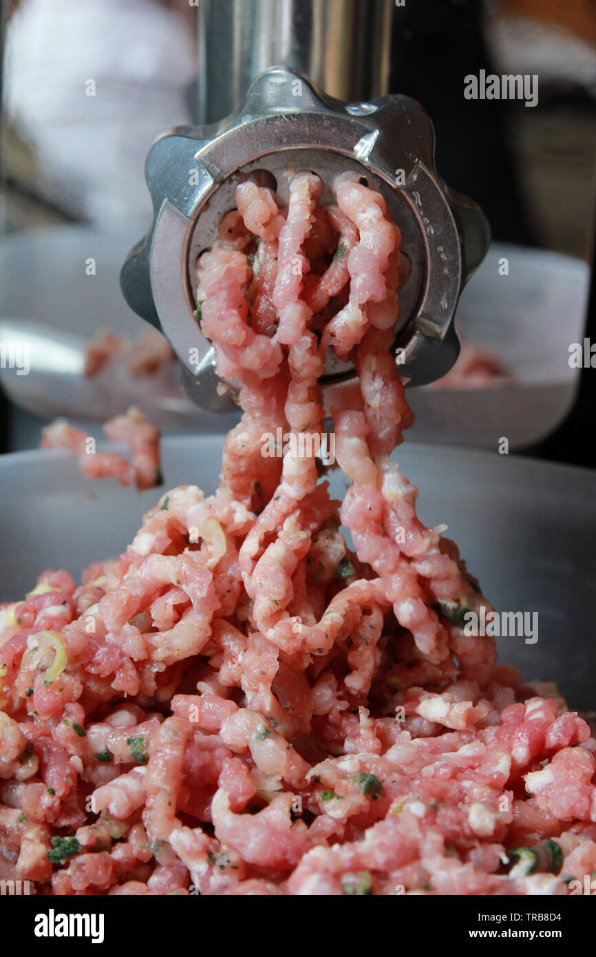 meat grinder in work Stock Photo Alamy