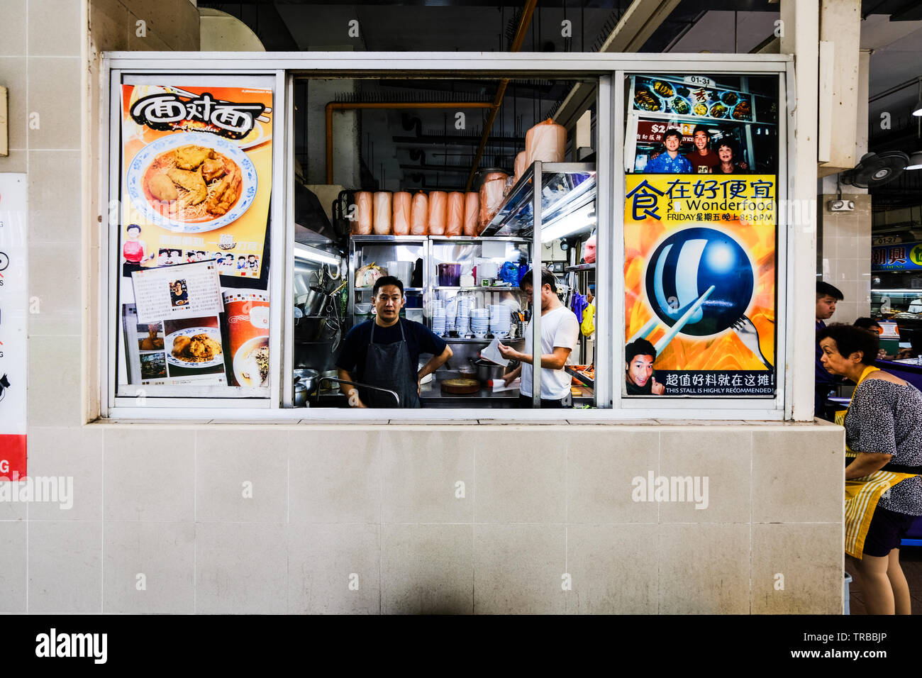 Chefs at a Hawker Market in Singapore Stock Photo