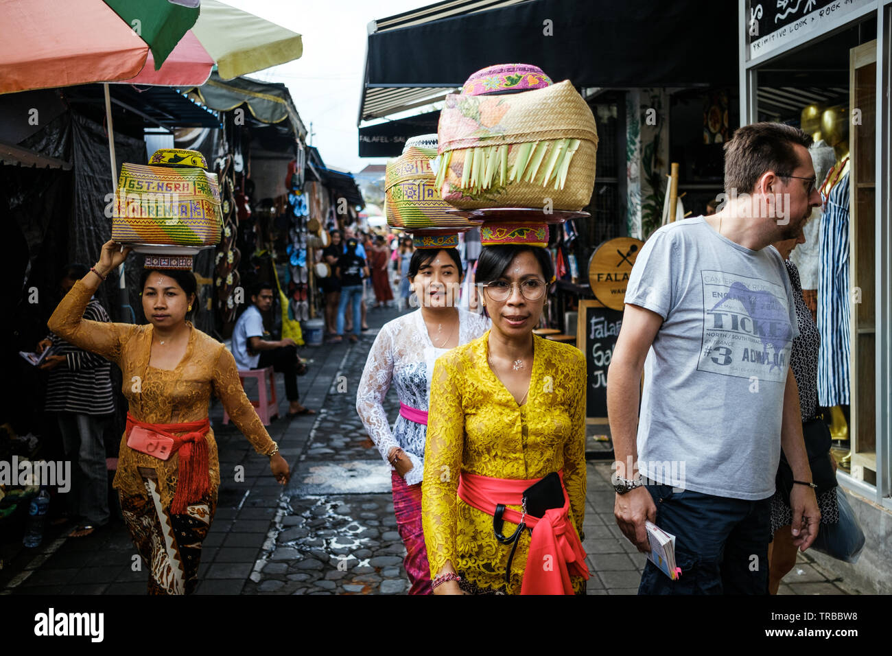 Three Indonesian Females in traditional dress in Ubud Market, Bali Stock Photo