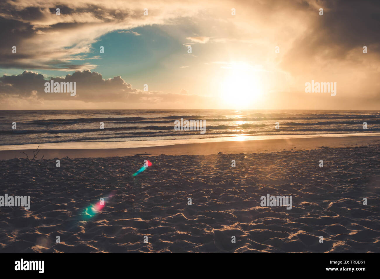 Beautiful sunset on the tropical beach with sky and clouds for travel ...