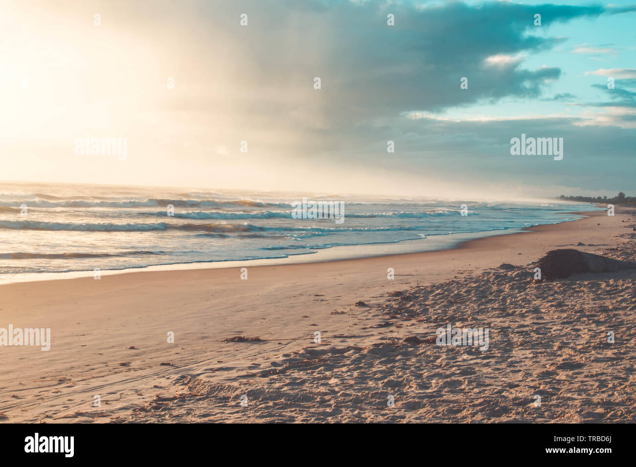 Beautiful sunset on the tropical beach with sky and clouds for travel ...