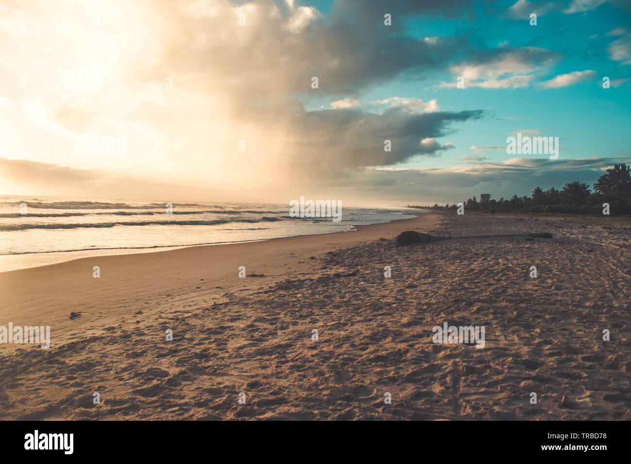 Beautiful sunset on the tropical beach with sky and clouds for travel ...