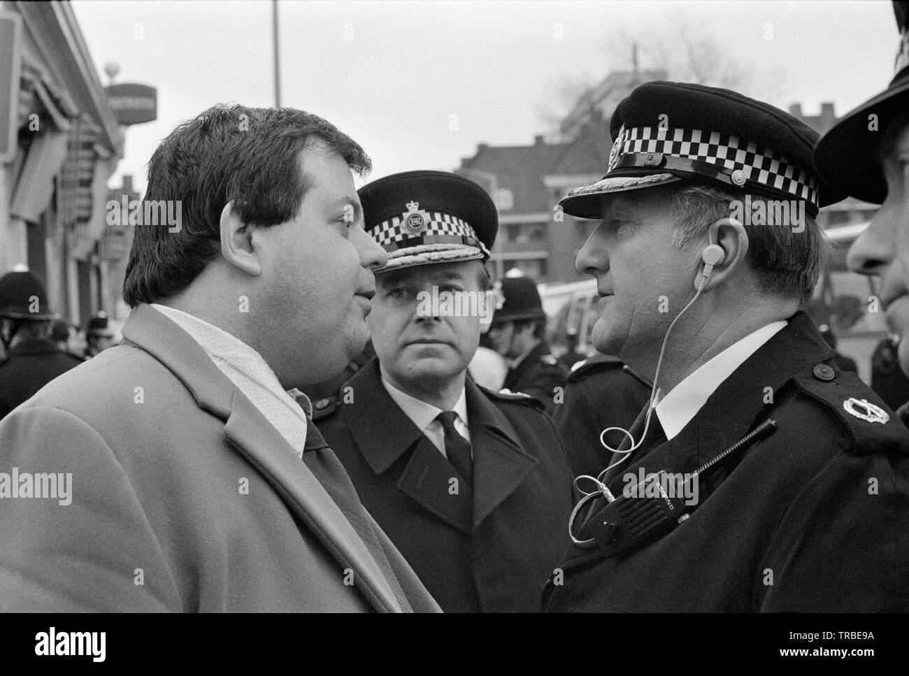 1980. A march by the National Front, a British Far Right Fascist Political Party, in Camberwell New Road, London, headed by its then leader Martin Webster, who is seen talking to the police. Stock Photo