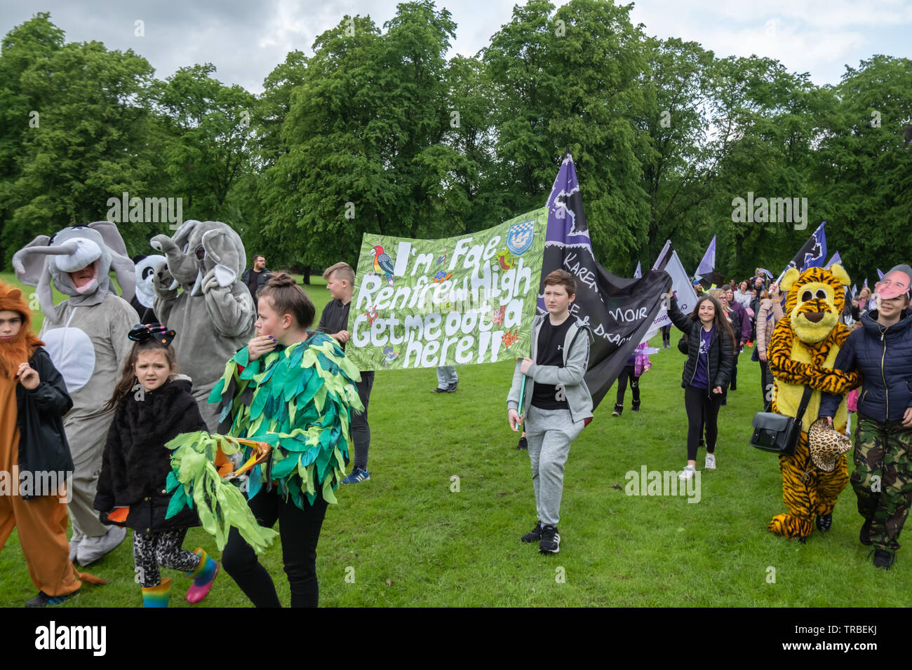 Renfrew, Scotland, UK. 2nd June, 2019: A banner is carried that says I'm Fae Renfrew High Get Me Oot A Here at the annual Renfrew Gala Day which starts with a procession through the streets of Renfrew from Canal Street to Robertson Park. Credit: Skully/Alamy Live News Stock Photo