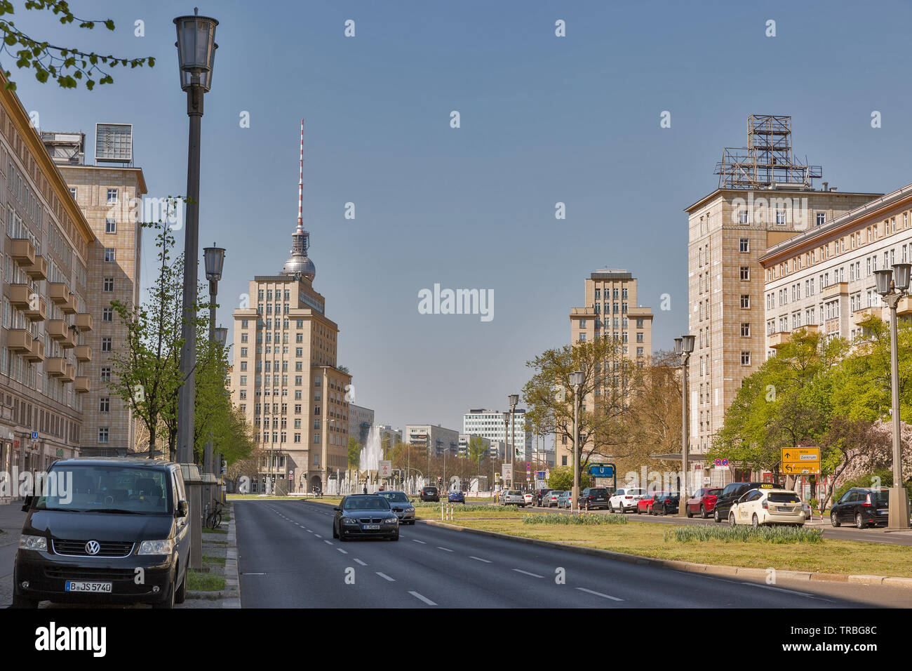 BERLIN, GERMANY - APRIL 18, 2019: Street traffic on Strausberger Platz and Karl Marx alley in downtown. Berlin is the capital and largest city of Germ Stock Photo