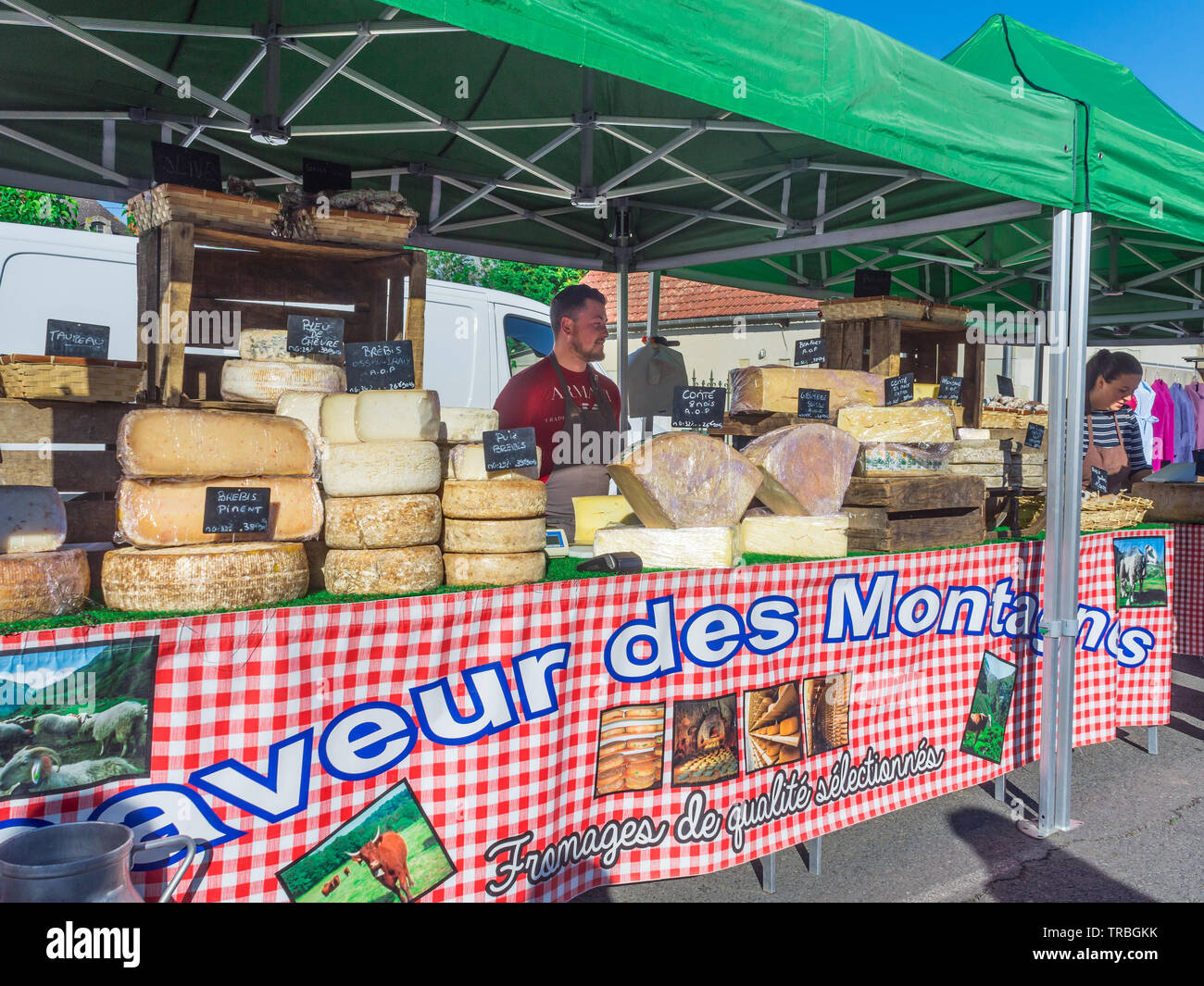 Mountain cheeses for sale on market day in Les Hérolles, Vienne, France. Stock Photo