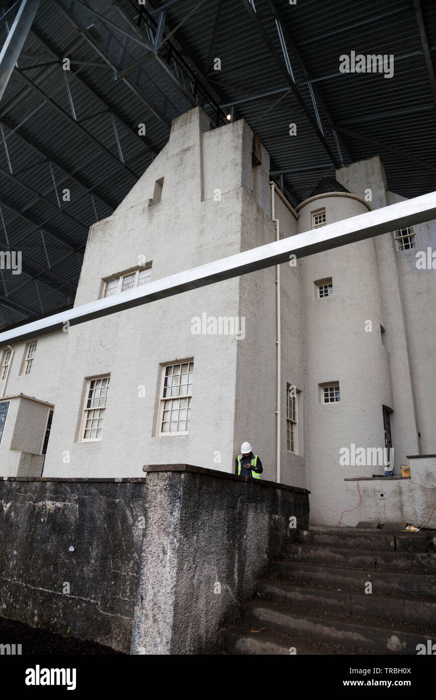 Hill House, Helensburgh, Scotland, designed by Charles Rennie Mackintosh, and owned by the National Trust for Scotland, is having a protective metal b Stock Photo