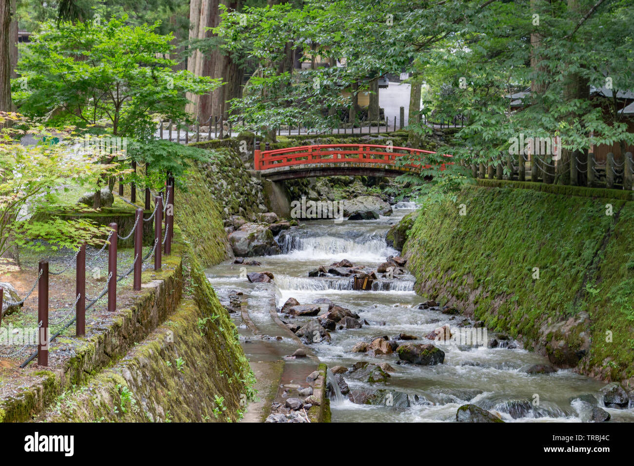 Temple Buildings And Red Wooden Bridge Over Stream Eiheiji Japan Stock Photo Alamy