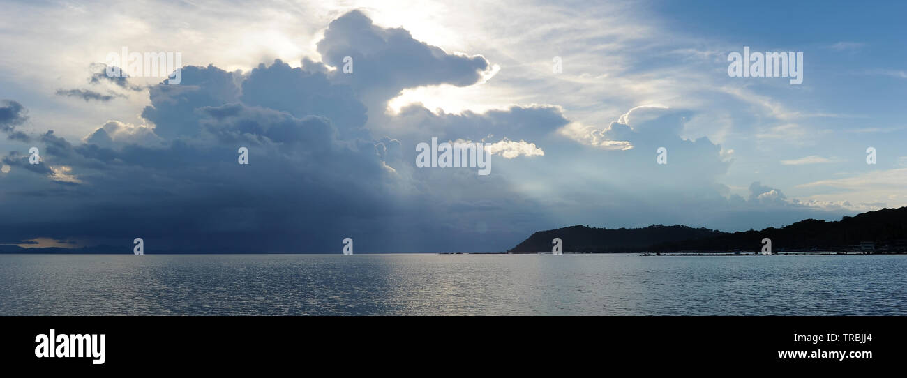 Storm over the sea. Horizontal panoramic view copy space for text on stormy cloudscape blue grey colour horizon over water during sunset, bright color Stock Photo