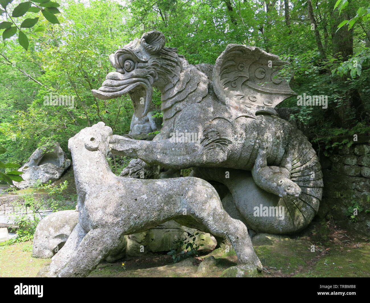 Mythological creatures are some of the giant stone sculptures at the eccentric Sacro Bosco Park near Bomarzo, central Italy Stock Photo