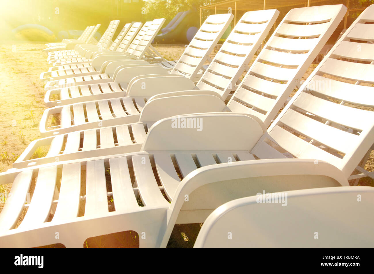 a lot of empty chaise lounges Stock Photo