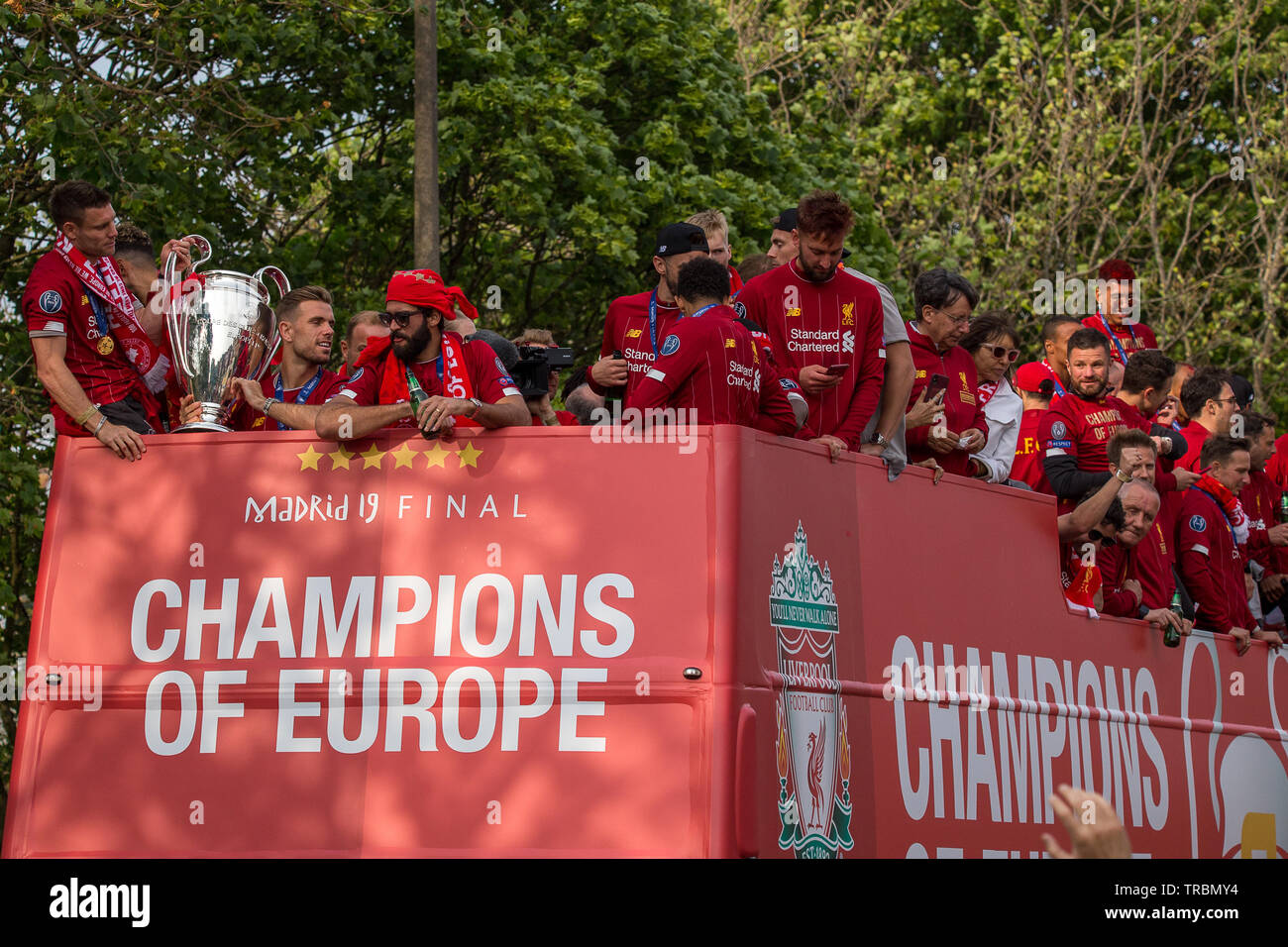 The players and management of Liverpool Football Club seen on an open top bus parading the Champions League trophy through the streets of Liverpool on Stock Photo