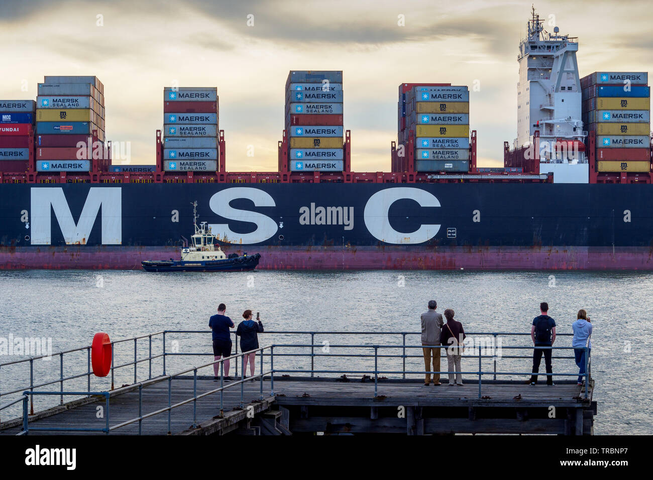 Shipwatching - onlookers watch the MSC Sveva container ship entering the Port of Felixstowe in the UK Stock Photo