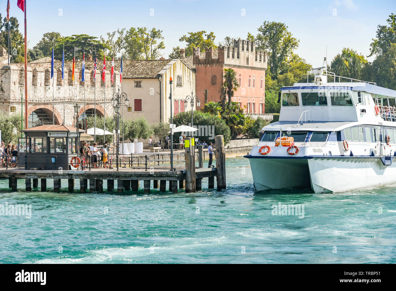 LAZISE, LAKE GARDA, ITALY - SEPTEMBER 2018:  High speed passenger ferry alongside the jetty in Lazise on Lake Garda. Stock Photo
