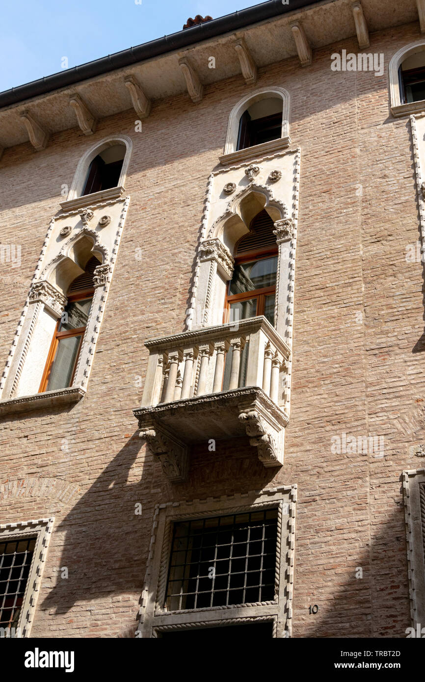 An ornate balcony on the facade of Palazzo Thiene on Contra Porti, Vicenza, Italy Stock Photo