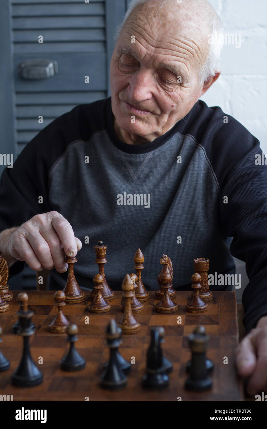 Senior Man Thinking about His Next Move in a Game of Chess Stock Photo -  Image of king, checkmate: 64993646