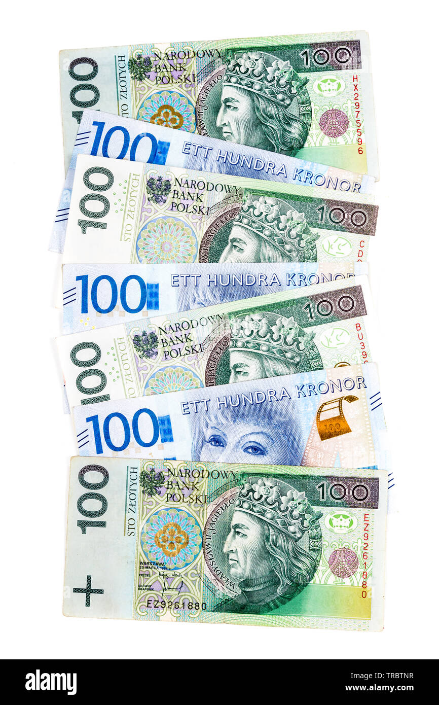 Mix of scattered Polish Zloty 100 notes and Swedish Krona 100 notes background Stock Photo