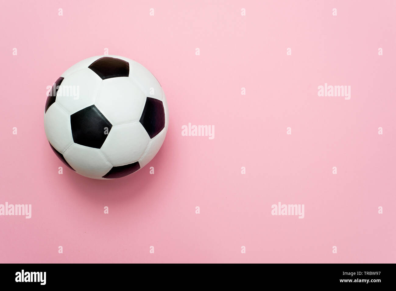 soccer ball or football on pink background Stock Photo - Alamy