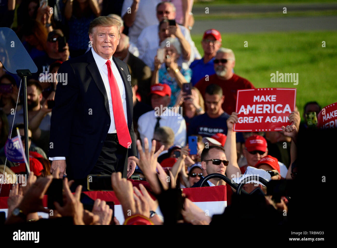 US President Donald J. Trump greets supporters as he deplanes a Boeing C-32 Air Force One ahead of a MAGA rally in Montoursville, PA on May 20. Stock Photo