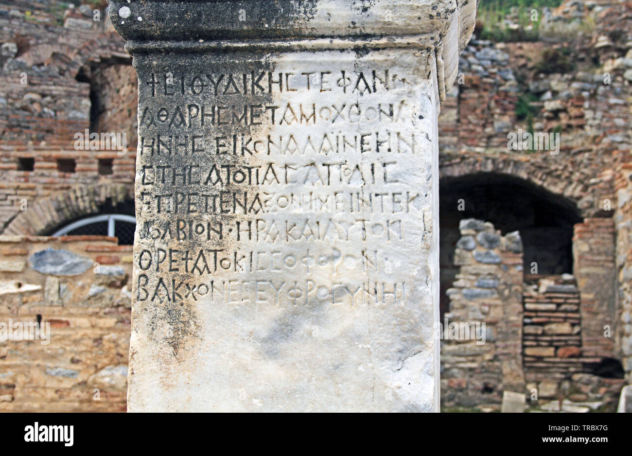 Ancient Text on a Marble Pillar in Ephesus, Turkey Stock Photo