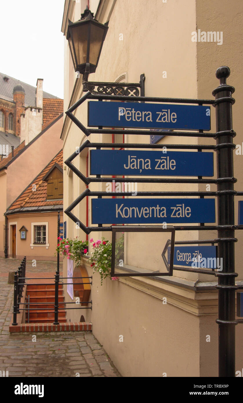 Old Town Riga Latvia. Direction signs in Riga in a narrow cobbled ...