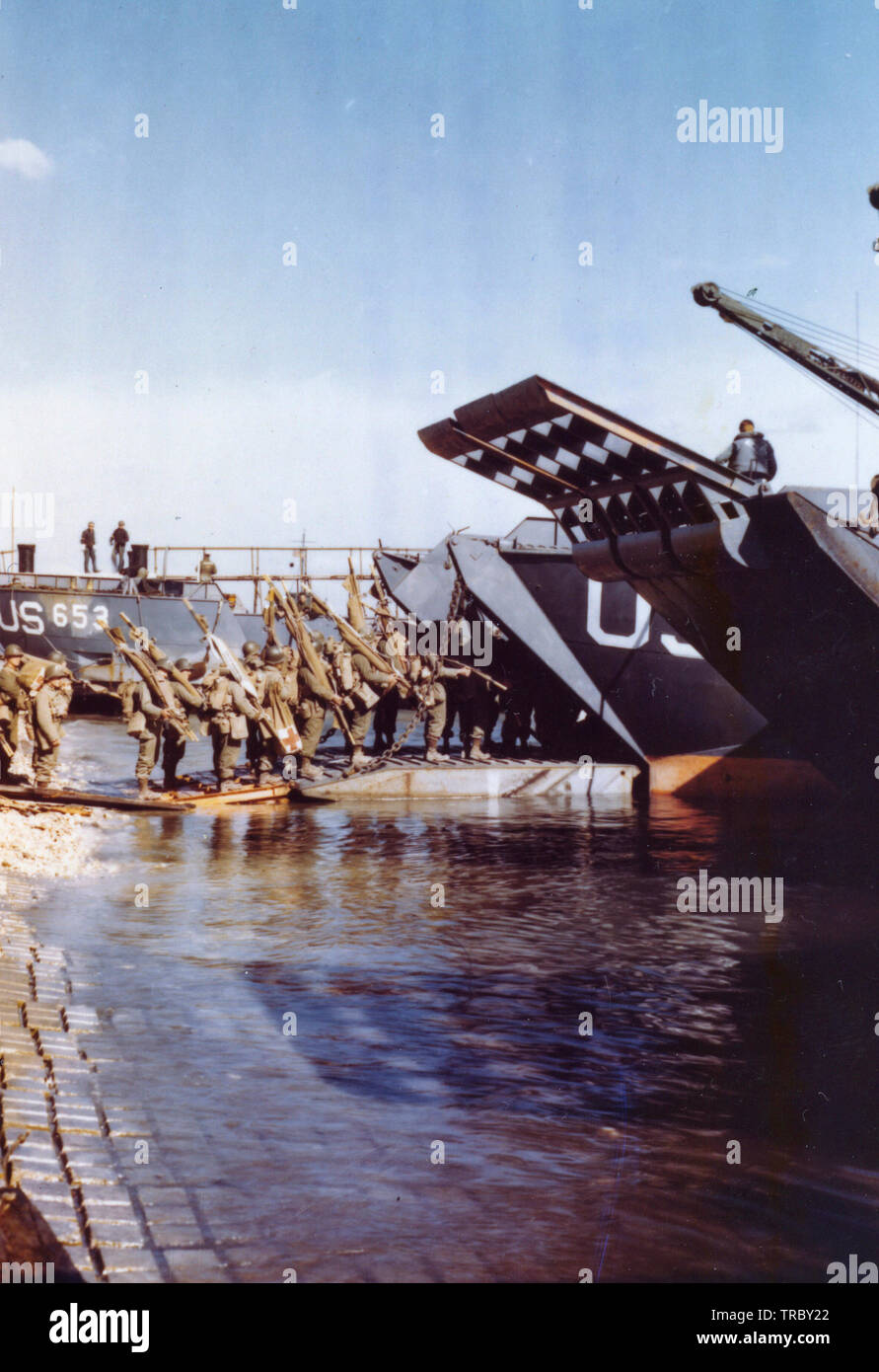 Medics and litter bearers going up the ramp of an LCT which will take them to France for the assault against Hitler’s Europe. June 6, 1944 Stock Photo