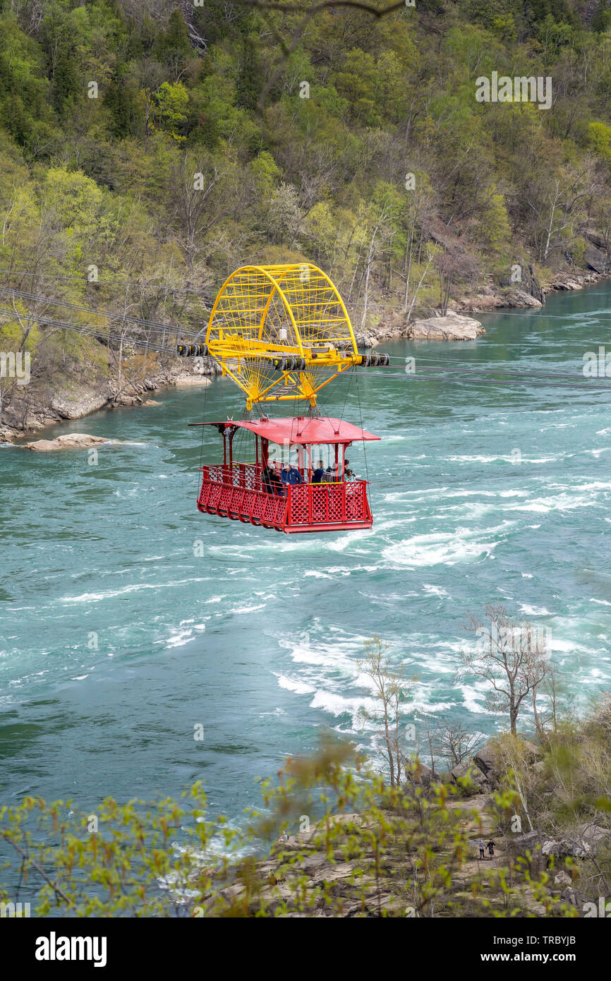 Niagara Falls, Canada - May 18, 2019: Aero Cable car suspended on a sturdy cable with the view of the Niagara Whirlpool wild rivers from Niagara Falls Stock Photo