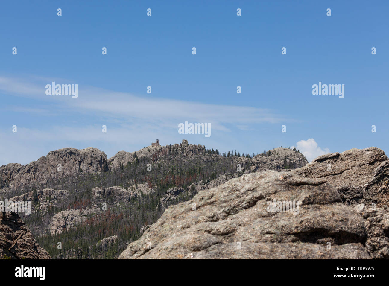 Black Elk Peak ( formerly Harney Peak) and tower which overlooks eroded rock formations and a