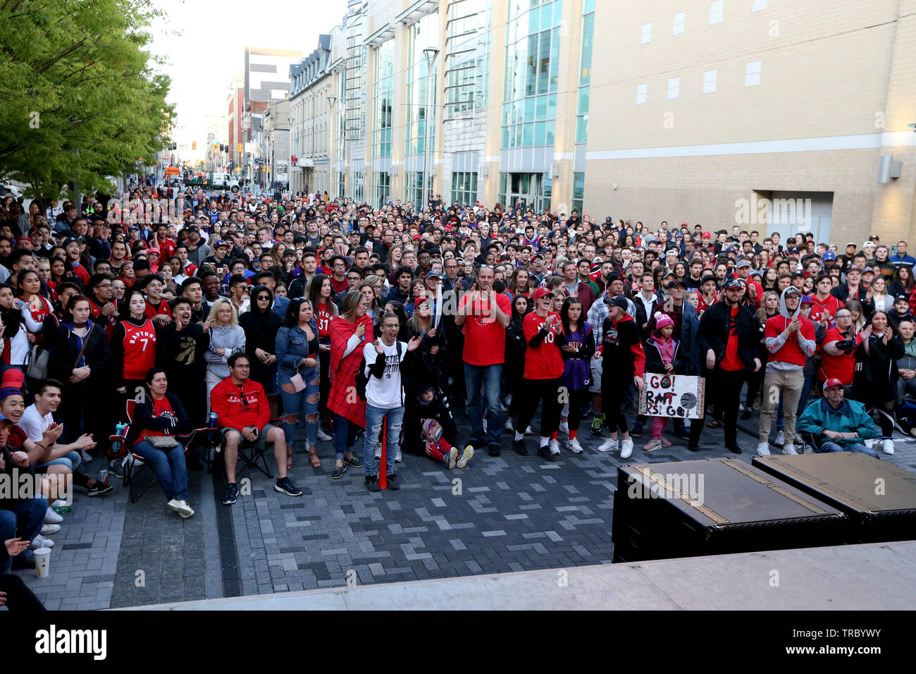 Fans sand head down to Jurassic Park in Downtown London Ontario to Cheer on the Toronto Raptors for Game 2 of the NBA Finals. Stock Photo