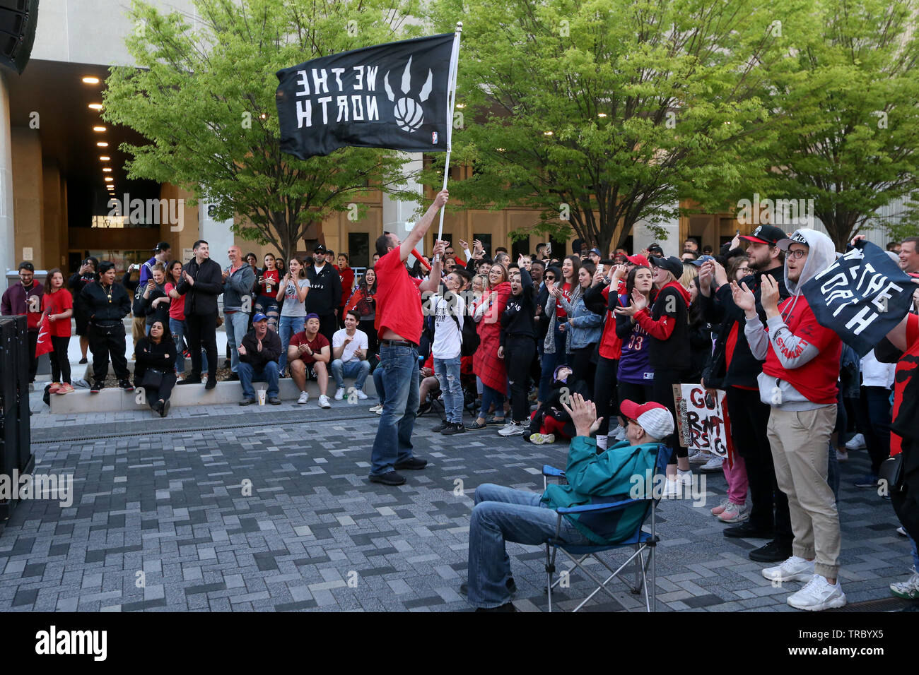 Fans sand head down to Jurassic Park in Downtown London Ontario to Cheer on the Toronto Raptors for Game 2 of the NBA Finals. Stock Photo