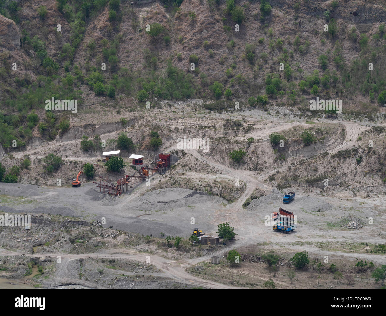 Aerial photo of quarry in the Philippines with trucks and production equipment Stock Photo
