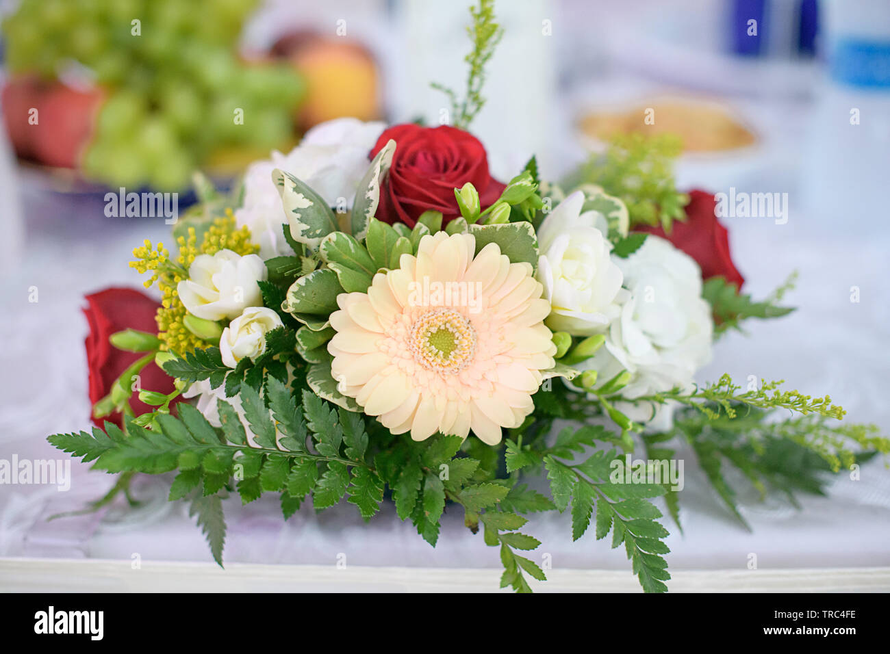 Romantic wedding decor for bride and groom or guests dinner tables at the reception venue or restaurant with beautiful floral centerpieces Stock Photo