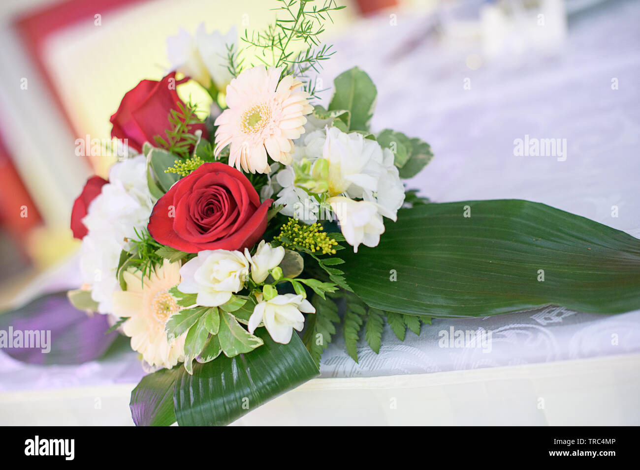 Romantic wedding decor for bride and groom or guests dinner tables at the reception venue or restaurant with beautiful floral centerpieces Stock Photo