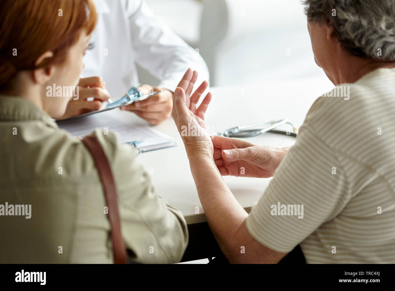 Female doctor talking senior male hi-res stock photography and images ...