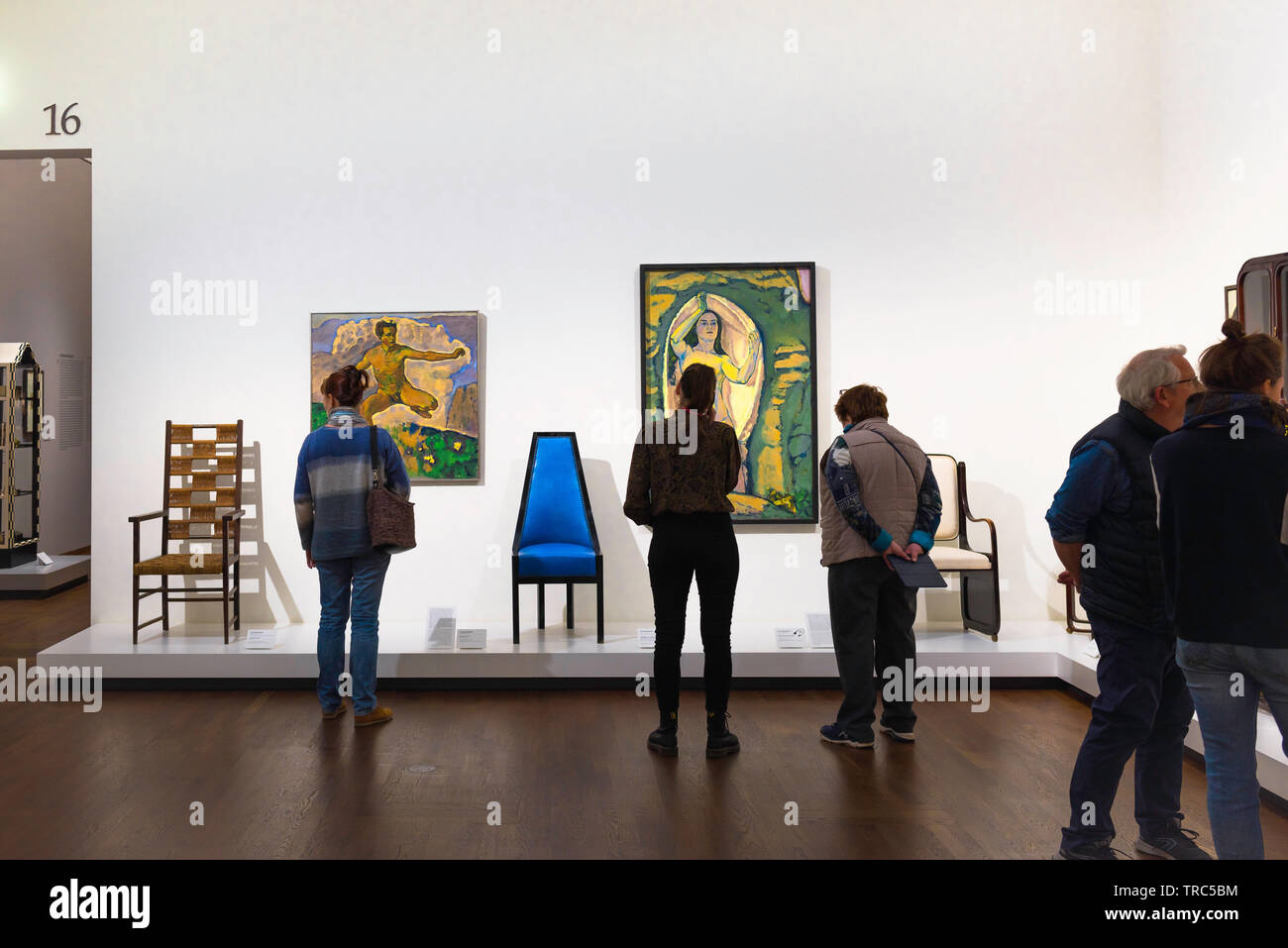 Leopold Museum Vienna, view of people looking at chairs and paintings created by the Secession Group artist Koloman Moser in the Leopold Museum, Wien. Stock Photo