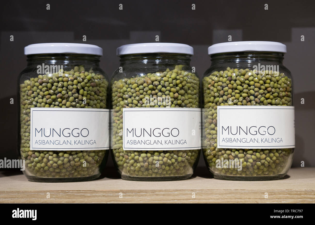 Manila, Philippines - August, 4, 2016: Glass jars with green mung beans (munggo) on dispaly in a store Stock Photo