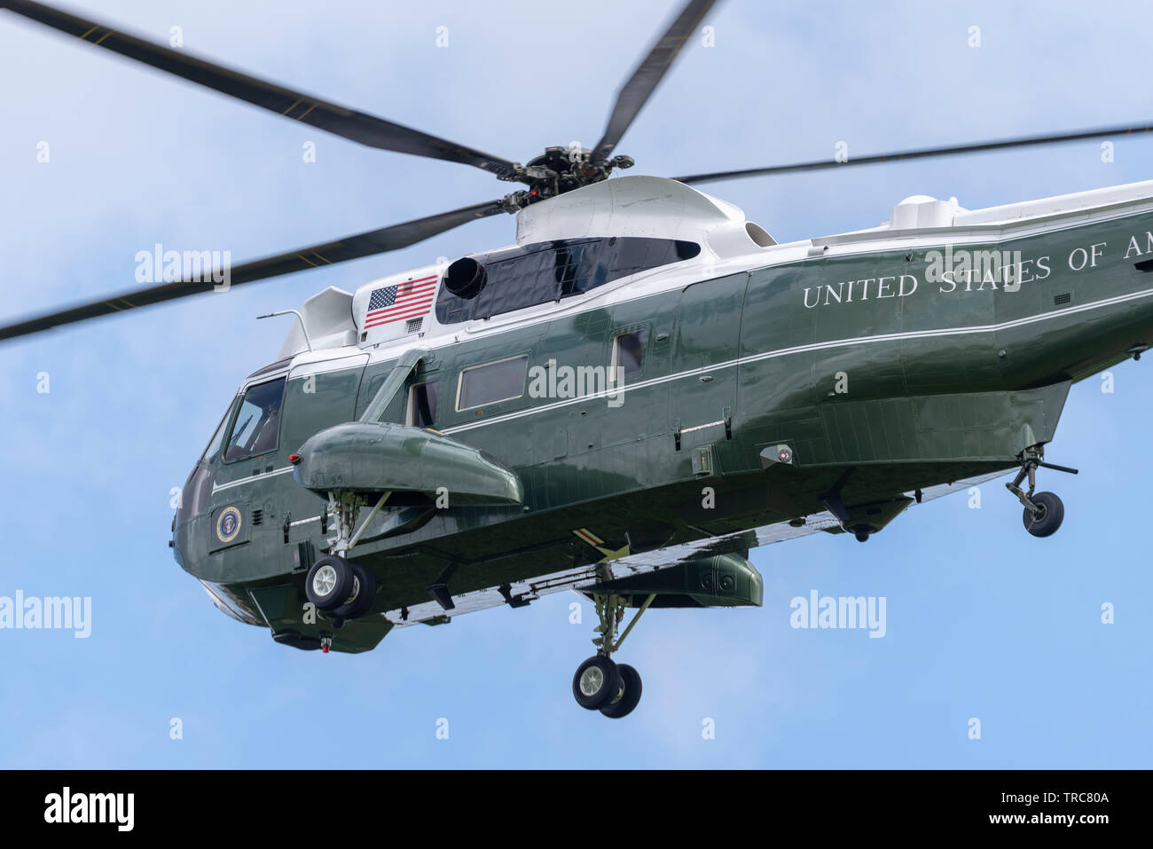 US President Donald Trump arriving for State Visit at Winfield House, the official residence of the US Ambassador to the UK Woody Johnson, escorted by military units for security and support. The green VH-3D Sea King VIP helicopter carrying Trump has the callsign 'Marine One' but flies with a similar helicopter as decoy. Escorted by 2 US Army Chinook  and police helicopters for security. The group arrived over Winfield House, Regent's Park from Stansted Airport, Essex Stock Photo