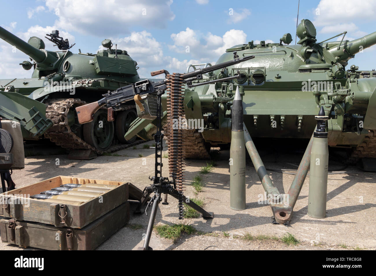 BUDAPEST/HUNGARY - 05.18, 2019: Old Russian weaponry in the field: tank shells in ammo crates, 120 mm rounds placed upwards, heavy machine gun on trip Stock Photo