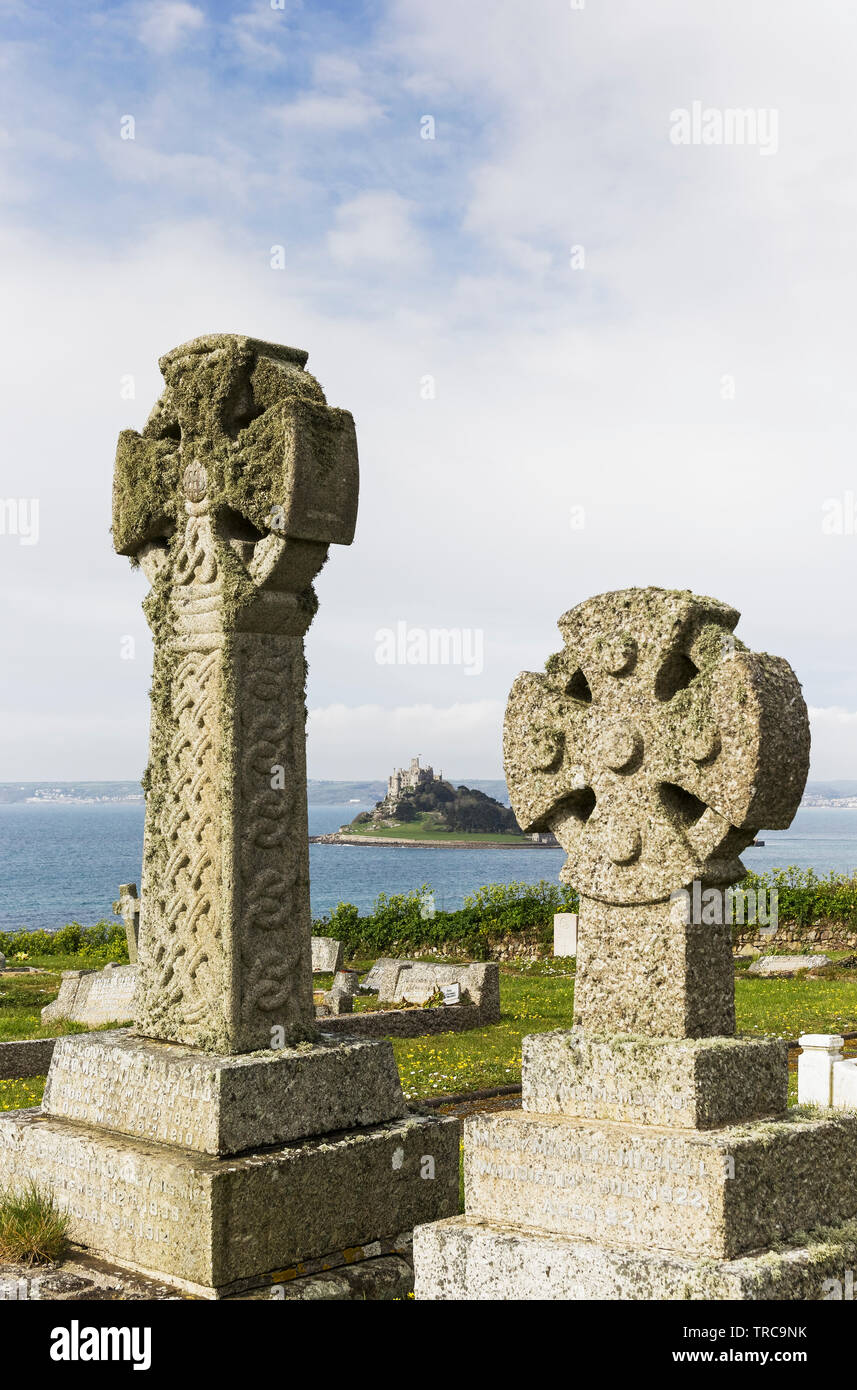 Celtic crosses in a Cornwall cemetery with St Michael's Mount in the ...