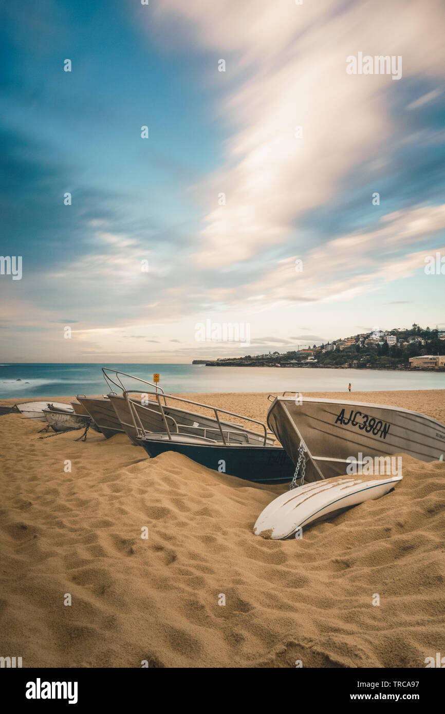 Boats lined up on Coogee Beach, New South Wales Stock Photo