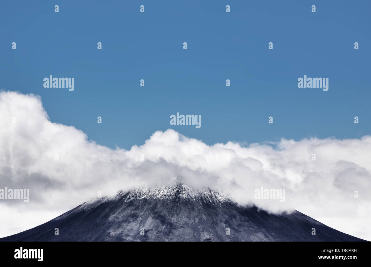 The top of Mount Ngauruhoe (Mount Doom) covered in clouds Stock Photo