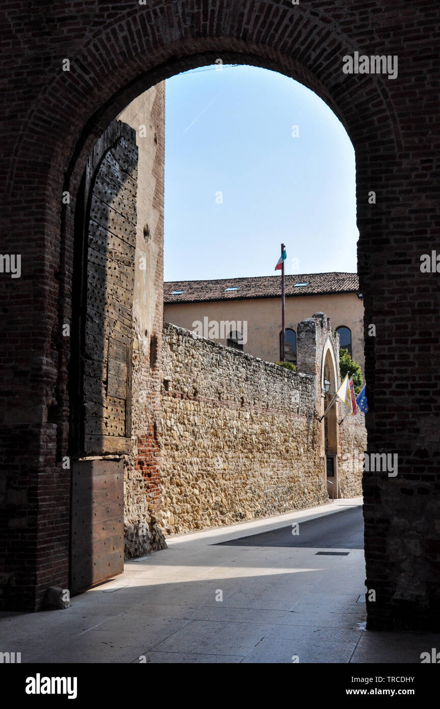 A view through one of the arches under Porta Aquila, a gate in the walled town of Soave, Italy Stock Photo