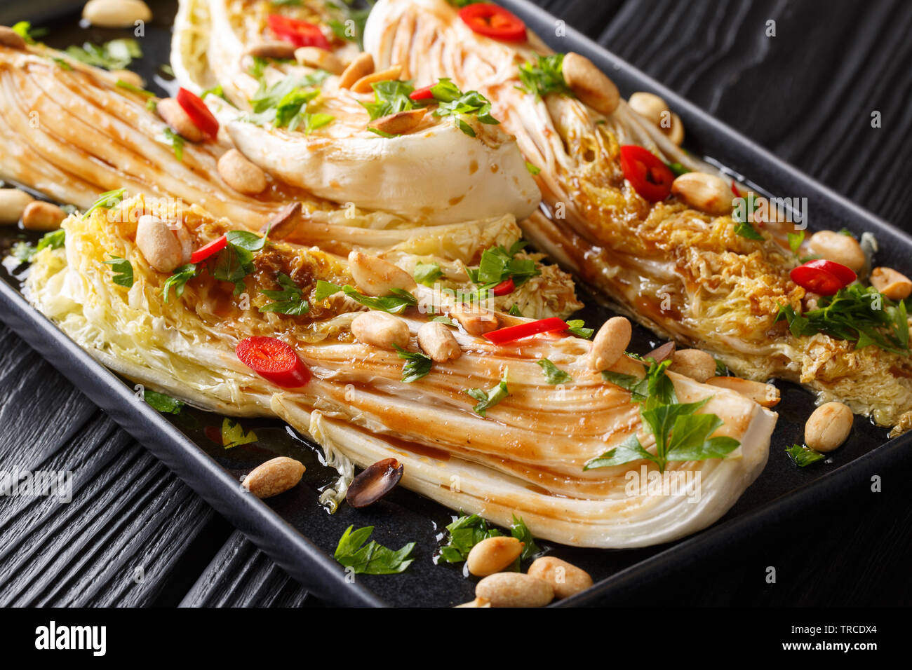 Roasted Chinese cabbage with soy sauce, chili pepper and crispy peanuts