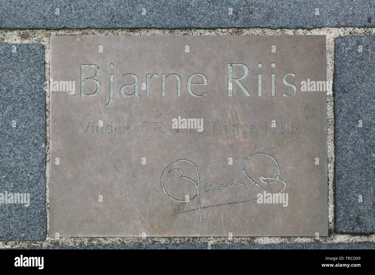 Herning, Denmark - April 9, 2016: Commemorative plaque in city of Herning, Denmark and tribute to Bjarne Riis cyclist, winner of the Tour de France Stock Photo
