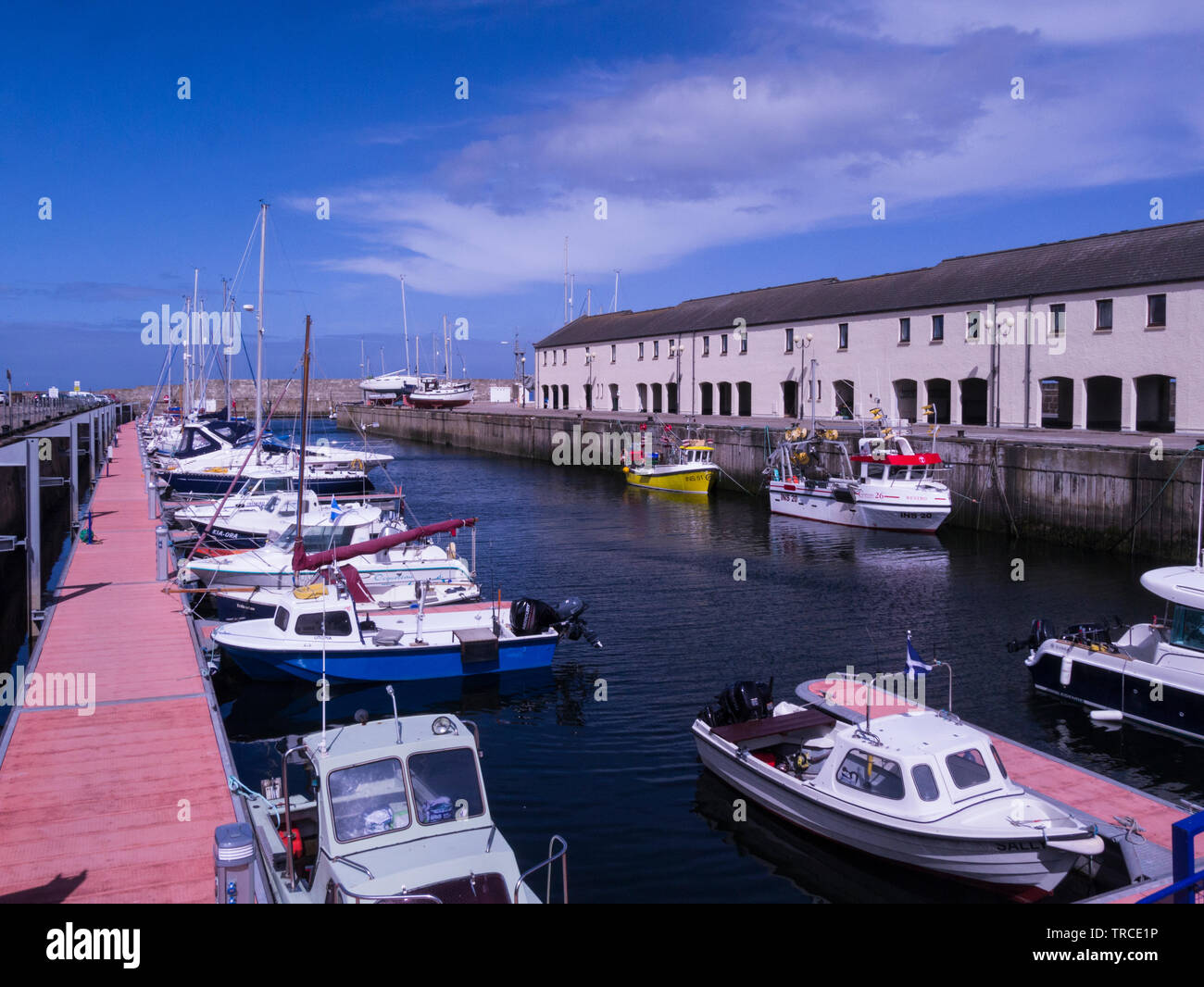 Yachts and motor boats moored in new Lossiemouth harbour Moray Speyside Northern Scottish Highlands on Moray Coast Trail Stock Photo