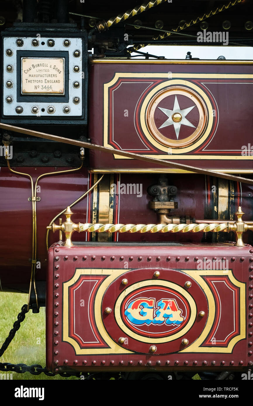 Side view of a red, vintage steam traction engine Stock Photo